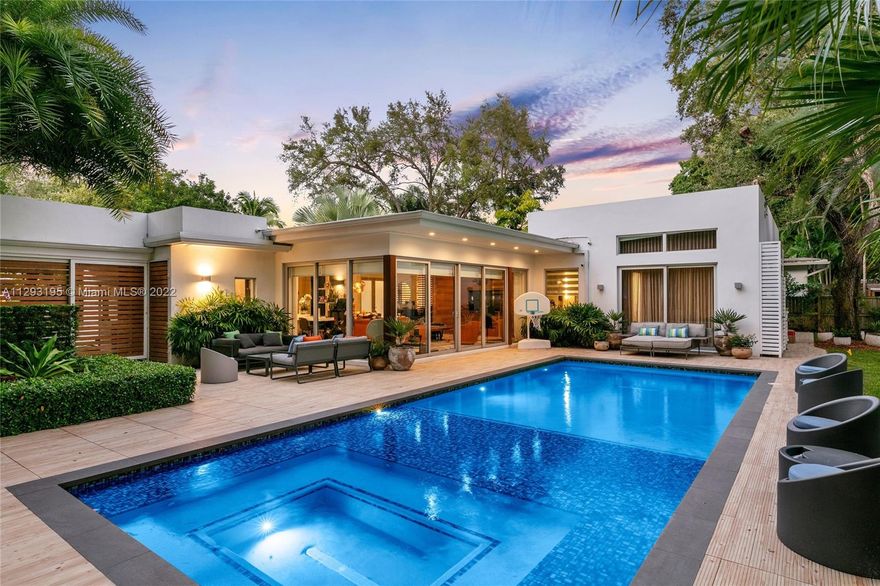 Built & designed by Maurice Weintraub Architects & gut renovated in 2016 by Architect Ralph Tait, this mid century modern home situated on a rare 13,375 SF Lot is a masterpiece of design. Featuring Everest white and Carrara marble floors, large Chef's kitchen w/ Quartz counters & top of the line appliances including double oven, gas cooktop, custom cabinets w/ built-ins & island w/ sink. Spacious primary suite features European white Oak floors, vaulted ceilings, oversized custom closet, shower & separate soaking tub, dual sinks. Enjoy expansive views overlooking the pool with built-in hot tub, putting green, lush tropical landscaping, outdoor kitchen & cabana. This Prime North Coconut Grove location is close to all of the top schools, restaurants & retail that coconut grove has to offer.