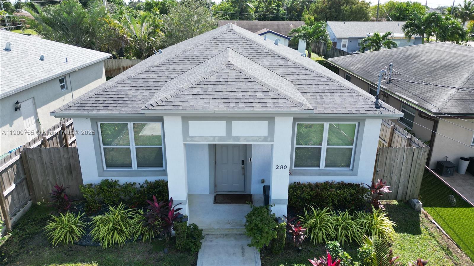 3 bed, 2 bath home in Oakland Park! This modern gem features tile floors throughout, an all-wood kitchen with granite counters, and stainless steel appliances—including washer & dryer. Enjoy peace of mind with impact glass windows, full insulation, and high-efficiency A/C. Spacious master suite with walk-in closet. No HOA, no fees! FHA/VA approved. Seller offering help with closing costs. Built in 2019 with 1-year builder warranty. Close to Wilton Manors & beaches!