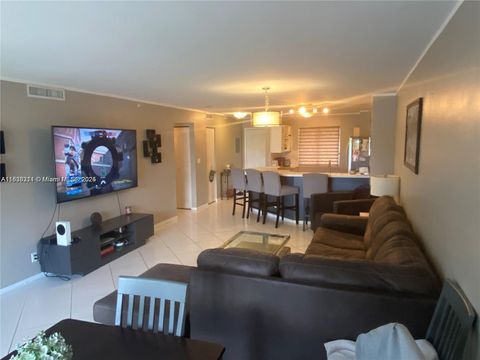 Photo of 2205 S Cypress Bend Dr #302, Pompano Beach, FL 33069 (MLS # A11838211)