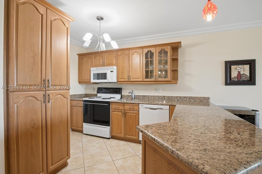 Photo of 1000 Hillcrest Ct #303, Hollywood, FL 33021 (MLS # A12048310)