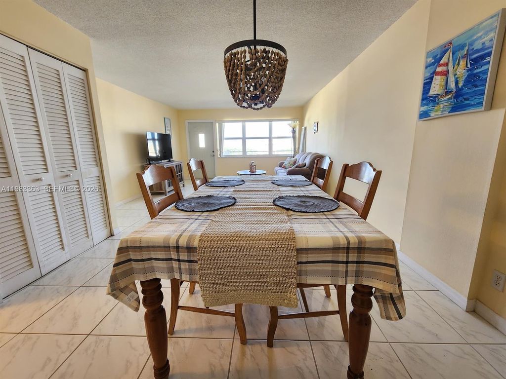 Photo of 401 Golden Isles Dr #1114, Hallandale Beach, FL 33009 (MLS # A11983363)
