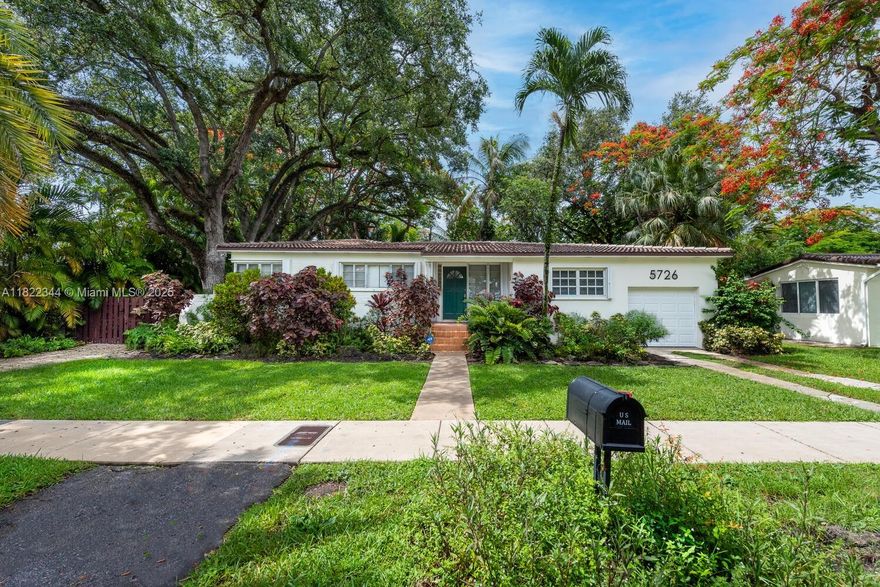 Mid-century charmer in David Fairchild School district. Retro 3/2 home on large lushly landscaped lot. Split floor plan, offers plenty of natural light, wood floors throughout with a nice and Cuban tile floor entry., Outside is the place to be, large wood deck is perfect for entertaining or quiet relaxation. Fenced yard has a nice shed for extra storage or workshop. this is a very cool house.