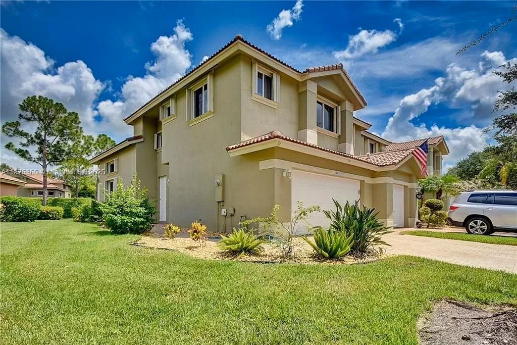 Welcome to Heron Bay’s Fairways community! This corner-lot townhouse offers serene views with tropical landscaping and a peaceful fountain backdrop. The remodeled kitchen features granite countertops and stainless steel appliances, while the spacious primary suite includes walk-in closets and a luxurious bath with separate tub and shower. Enjoy a two-car garage with commercial-grade epoxy flooring, Samsung washer and dryer, brick paver patio and driveway, and accordion shutters. Located in a gated community with resort-style amenities: 3 pools, clubhouses, fitness centers, splash park, playground, clay tennis courts, basketball courts, and scenic trails. Zoned for top-rated A+ schools and just minutes from restaurants, shopping, and the Sawgrass Expressway.