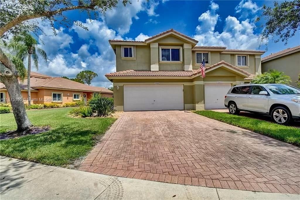 Photo of 12625 NW 56th St, Coral Springs, FL 33076 (MLS # A11875365)