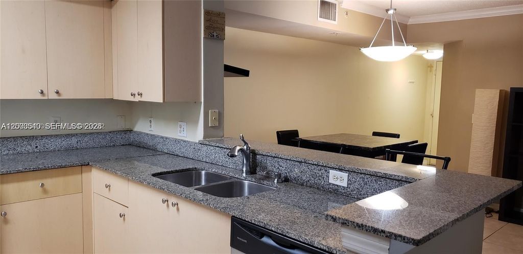 Photo of 2496 Centergate Dr #101, Miramar, FL 33025 (MLS # A12003540)