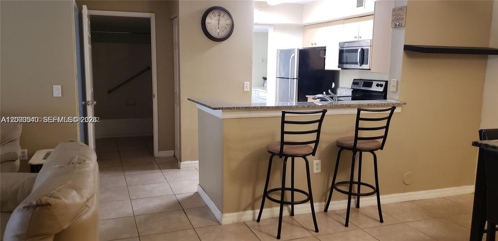 Photo of 2496 Centergate Dr #101, Miramar, FL 33025 (MLS # A12003540)