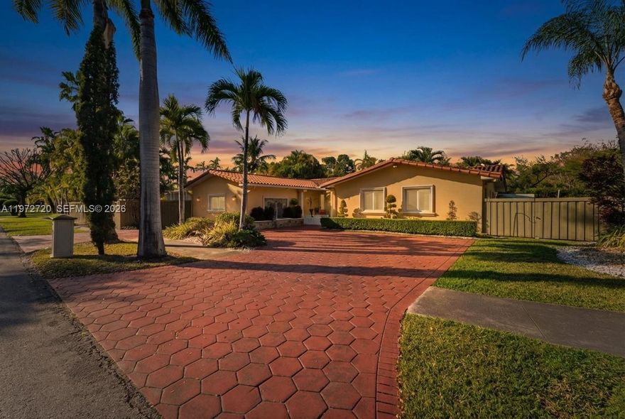 Beautifully maintained tropical retreat nestled on a quiet, tree lined street. This charming single story residence offers the perfect blend of comfort, privacy, and South Florida lifestyle living. From the moment you arrive, you are greeted by a spacious red paver driveway, lush landscaping, and mature palm trees that create stunning curb appeal. The home’s warm exterior and inviting entry set the tone for what awaits inside. Step into a bright and airy interior featuring neutral tones, elegant tile flooring throughout, and an open, flowing layout ideal for both everyday living and entertaining. The dining area is filled with natural light and seamlessly connects to the kitchen, which includes a breakfast bar and overlooks the backyard oasis. French doors lead you to your private outdoor paradise. The backyard boasts a sparkling pool surrounded by tropical landscaping, offering exceptional privacy and the perfect setting for gatherings, weekend relaxation, or soaking up the Miami sun. The generous lot provides ample space for entertaining, lounging, or creating your dream outdoor setup. Conveniently located near top rated schools, shopping, dining, and major roadways, this home combines tranquility with accessibility. A rare opportunity to own a move in ready property in a highly desirable Miami neighborhood, where comfort, charm, and lifestyle come together effortlessly.