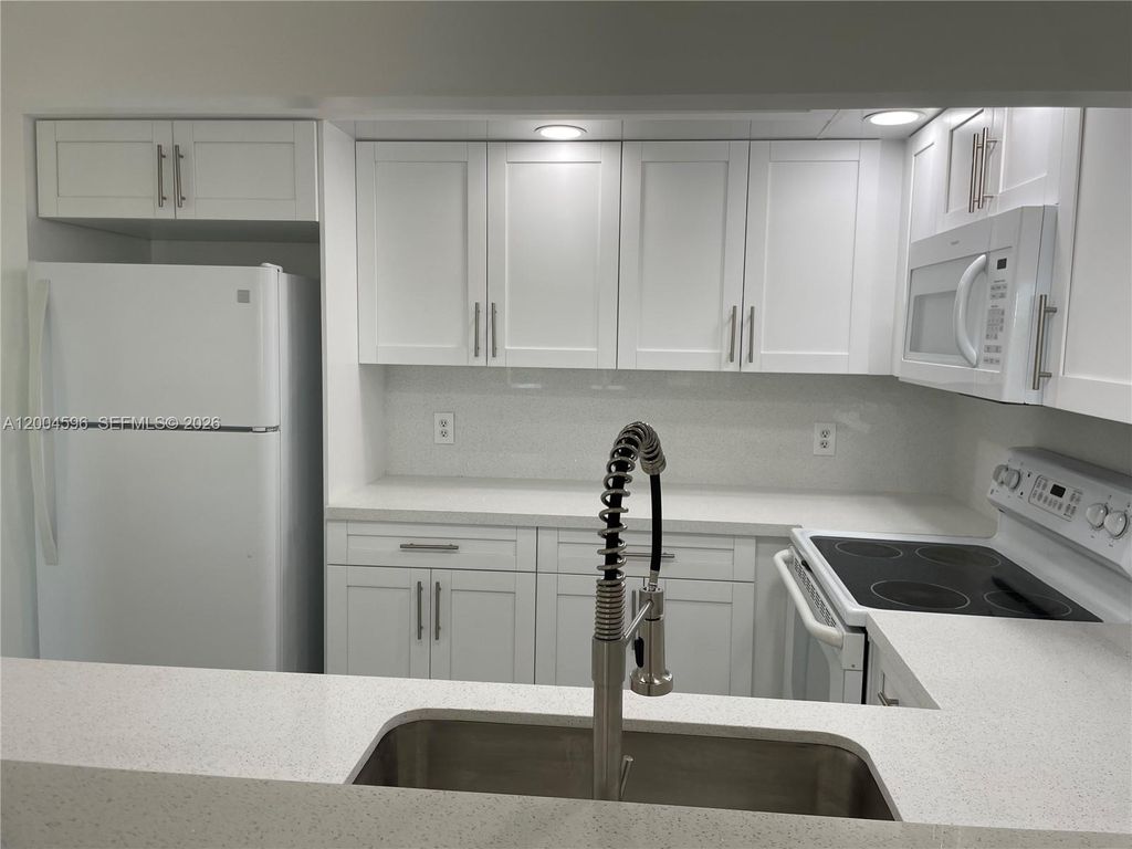 Photo of 12650 SW 6th St #412K, Pembroke Pines, FL 33027 (MLS # A12004596)