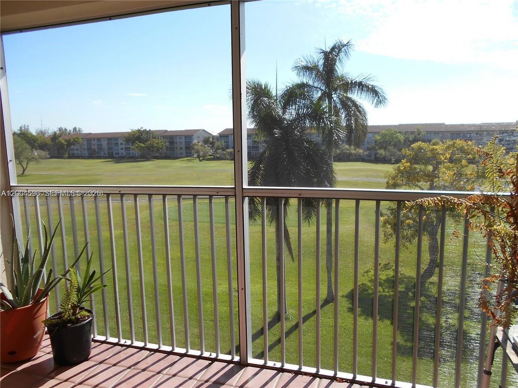 Photo of 12650 SW 6th St #412K, Pembroke Pines, FL 33027 (MLS # A12004596)