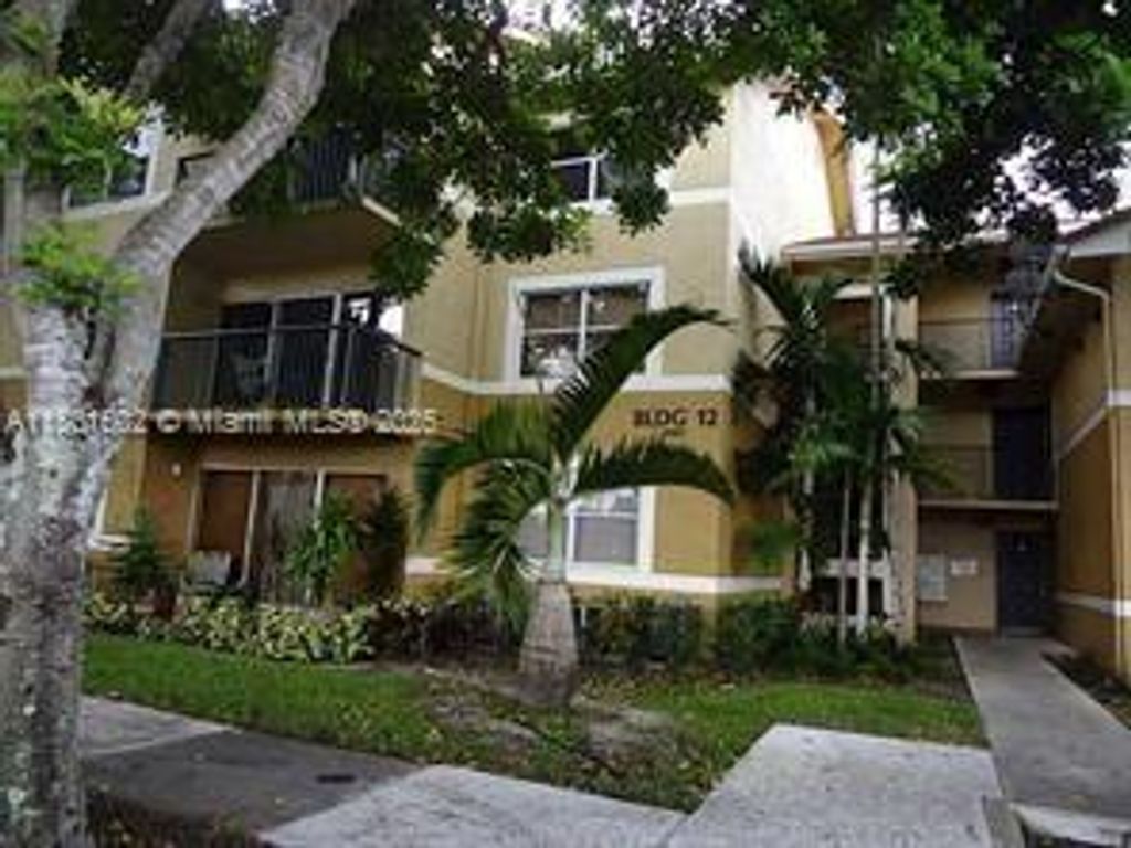 Photo of 8781 Wiles Rd #101, Coral Springs, FL 33067 (MLS # A11801502)