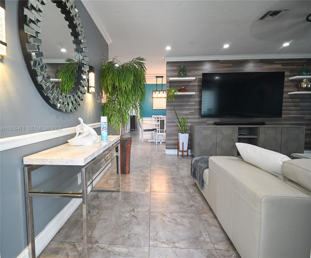 Photo of 7105 SW 3rd Ct, North Lauderdale, FL 33068 (MLS # A11956471)