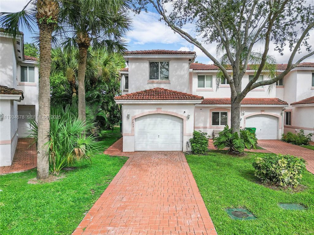 Photo of 7659 Tamarac Island Circle, Tamarac, FL 33321 (MLS # A11934678)