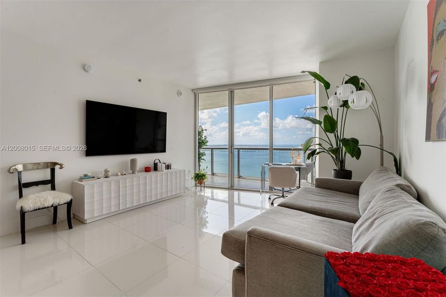 A beautifully furnished 1 Bed/1 Bath condo with over 1,000 interior sq ft, white porcelain tiled floors in living areas, marble floors in the bathroom, motorized shades, a large walk-in closet, kitchen appliances by Wolf & Sub-Zero, 10-foot-high ceilings w/floor-to-ceiling glass windows, and breathtaking views of Biscayne Bay & city skyline from the 35th floor. The largest one-bedroom floor plan at Icon Brickell. Includes 1 assigned parking space. Monthly condo dues cover basic cable TV, high-speed internet, & water. Building amenities include a 300-foot-long swimming pool, 50-person hot tub, movie theater, a 28,000-square-foot spa & fitness center, full-service concierge, on-site restaurants, & more. Within blocks of the shops & restaurants at Brickell City Centre & Mary Brickell Village.