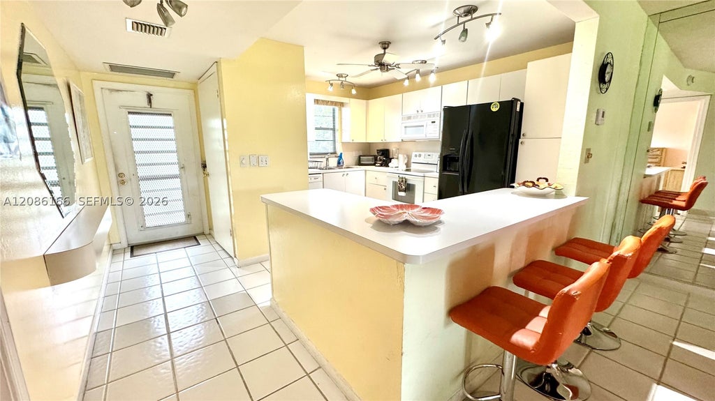 Photo of 2420 S Deer Creek Country Club Blvd #207-D, Deerfield Beach, FL 33442 (MLS # A12086166)