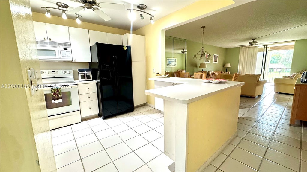 Photo of 2420 S Deer Creek Country Club Blvd #207-D, Deerfield Beach, FL 33442 (MLS # A12086166)