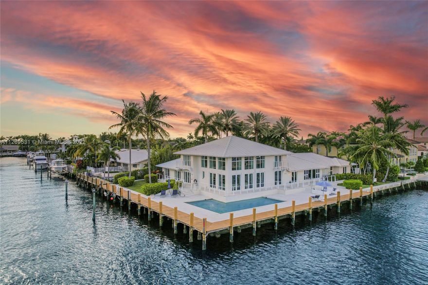 Southeast facing corner deep water point-lot home. This custom built home features a split floor plan making the primary bedroom en-suite secluded and private. 5 en-suite bedrooms/loft spaces with waterviews are perfect for family, guests, nursery, den or office space. This home boasts an expansive kitchen w/ upscale finishes including Italian marble, cherry wood, stainless steel appliances, powder room on the main level and hurricane impact doors/windows throughout. Enjoy your own private pool and spa, bar, family area, gym, loft with pool table and much more! Located in the highly sought after neighborhood of Coral Ridge Country Club this beautiful point-lot home sits directly on the intracoastal with 260 feet of water frontage. Located close to the beach, private golf course and park.