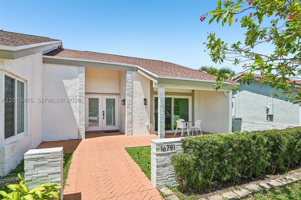 Photo of 16791 Royal Poinciana Dr, Weston, FL 33326 (MLS # A12063475)