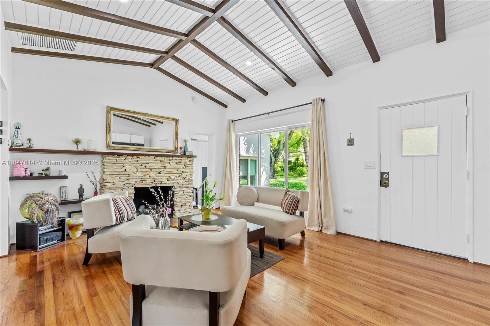 Step into the heart of Miami Shores and experience this beautifully updated 3-bedroom, 2-bathroom home that perfectly blends historic charm w/modern elegance. Set on a peaceful, tree-lined street, the home features original hardwood floors, a cozy fireplace, impact windows/doors, and a spacious, light-filled layout ideal for both relaxing and entertaining. The gourmet kitchen is equipped with quartz countertops, stainless appliances+ a stylish breakfast bar. Outside, a fully walled backyard offers lush landscaping, a serene patio area + total privacy. Attached 2-car garage and separate laundry/utility room. This home is within walking distance from the MS Shores Country Club, top rated schools, tennis/pickleball, the MS aquatic center+ downtown Miami Shores restaurants + shops.