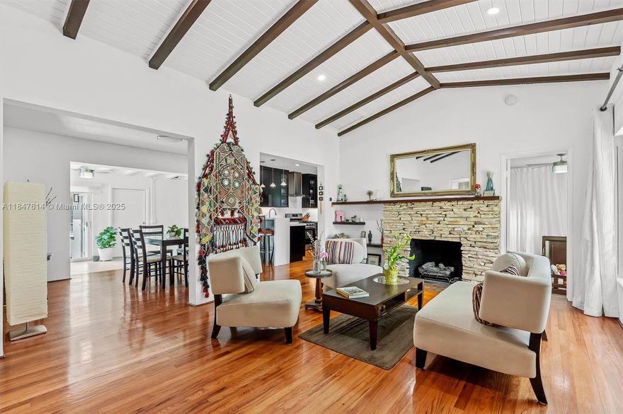 Beautifully updated 3-bedroom,2-bathroom home that perfectly blends historic charm w/modern elegance. (1850 +/- square feet under air) Set on a peaceful, tree-lined street, the home features original hardwood floors, a cozy fireplace, impact windows/doors, and a spacious,light-filled layout ideal for both relaxing and entertaining. The gourmet kitchen is equipped with quartz countertops, stainless appliances +a stylish breakfast bar. Outside, a fully walled backyard offers lush landscaping, a serene patio area + total privacy. Attached 2-car garage and separate laundry/utility room. Roof (2018). This home is within walking distance from the MS Shores Country Club,top rated schools, tennis/pickleball, MS aquatic center+ downtown Miami Shores restaurants + shops. No flood insurance required!