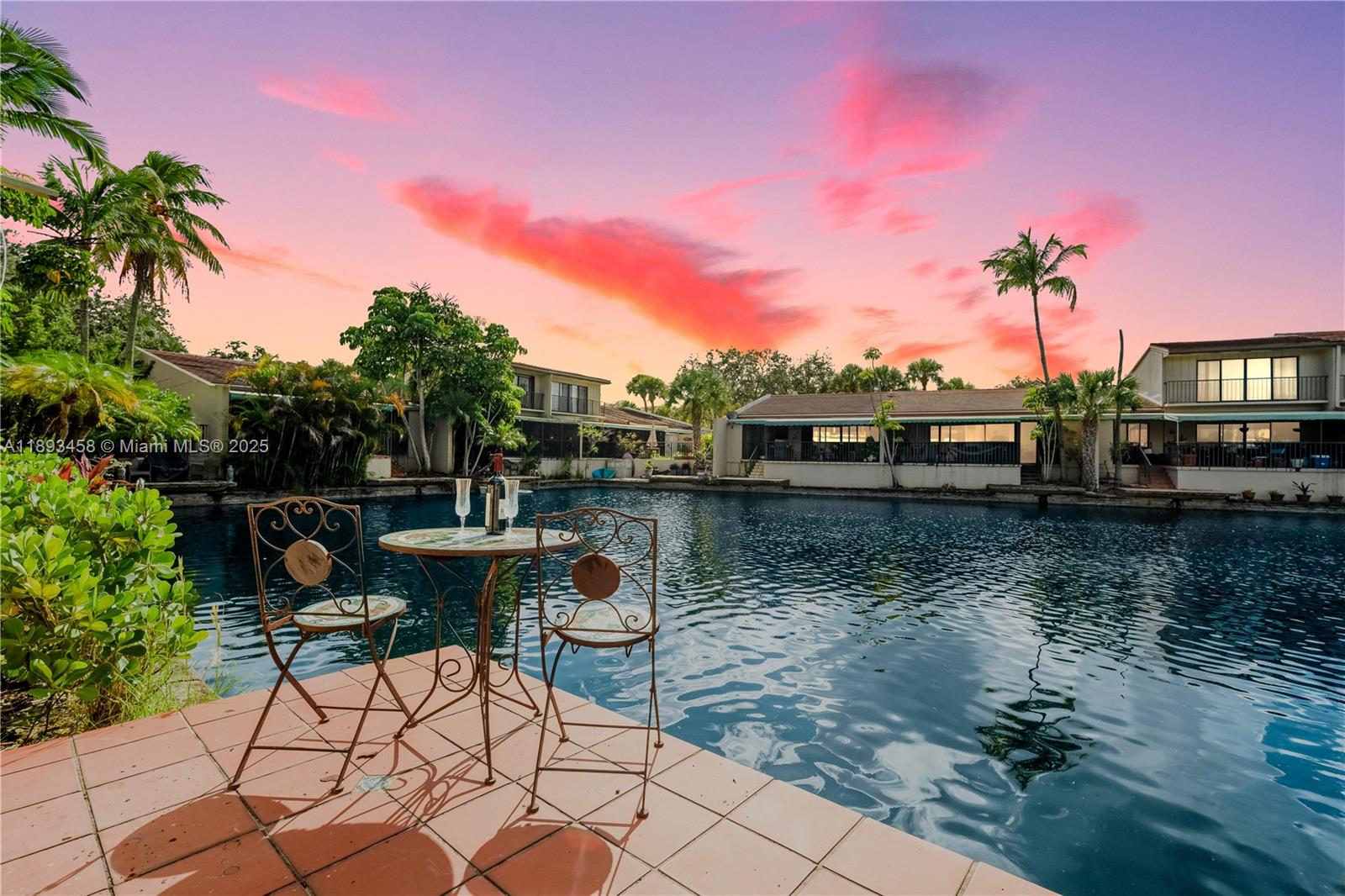 Discover your personal oasis at this townhome in the coveted Lake Sandra community. This 2-beds/2-baths home is designed for seamless indoor-outdoor living, with a covered patio and private dock that provide unparalleled views of the lake and stunning western sunsets. Imagine starting your day with a cup of coffee by the water and ending it with a glass of wine as the sky lights up in a symphony of color. The home also includes a versatile loft, ideal for a home office, a recreational space, or easily converted into a third bedroom.With a newer roof(2021) and hurricane shutters, this home is both beautiful and secure. Situated in a prime, central location, you're within walking distance of A+ schools, local parks, and a variety of dining options. This is more than a home; it's a lifestyle.