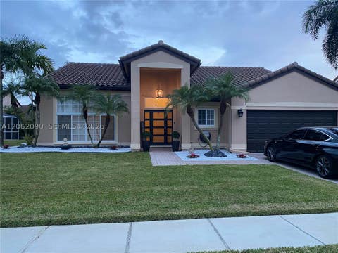 Photo of 19334 NW 12th St, Pembroke Pines, FL 33029 (MLS # A12062090)
