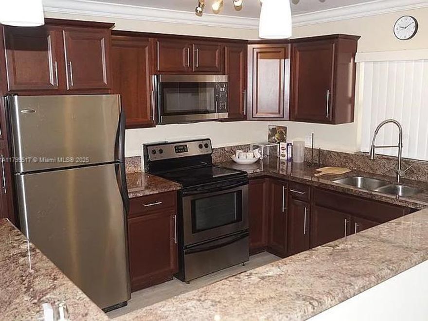A pleasure to live in! Fenced complex in the heart of Coral Springs. Recently remodeled corner unit. NO CARPETS. Open concept living area from kitchen to oversized balcony. Two very luminous bedrooms with two sets of windows each, all impact. Spa-like bathrooms with high end fixtures. Tankless water heater.