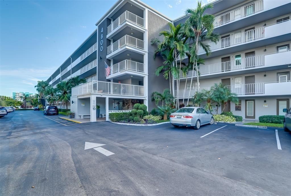 ASSESSMENTS PAID IN FULL BY SELLER! FURNISHED 2 BED / 2 BATH CONDO located in the 55+ building of HILLCREST COUNTRY CLUB. This condo is located on the TOP floor, therefore no additional upstair neighbors. Kitchen is equipped with a dishwasher and has a little sitting area. Big living area that leads to the immense balcony that is also connected to the primary bedroom. Balcony is screened in and does have hurricane shutters. Primary bedroom has a nice walk-in closet and its own bathroom. Building does have an elevator and plenty of guest parking spots. Great ameneties that are walking distance such as gym, exercise room, etc