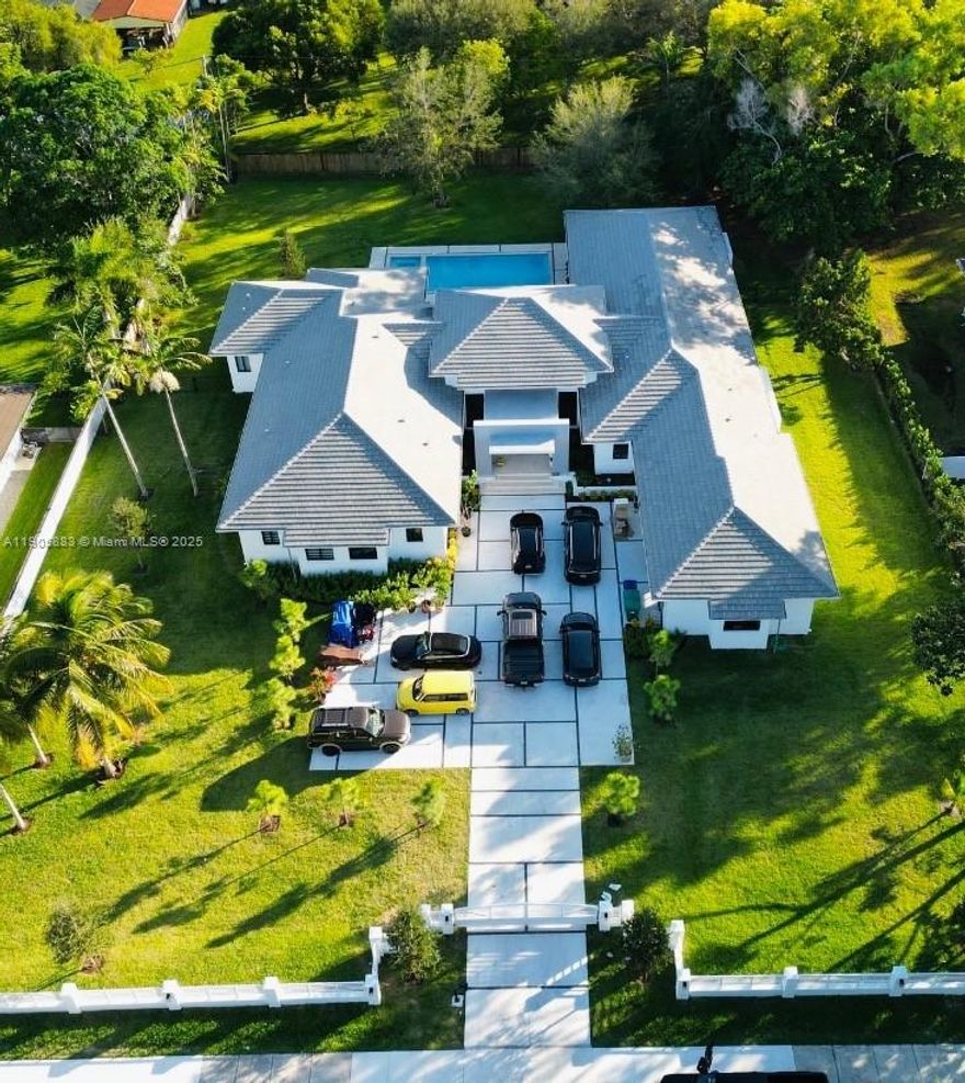 Pinecrest Custom Home Like New  - Acre lot - Gated Entry - Absolutely Gorgeous ! Dramatic Front Entry Double Glass doors , 22 ft ceiling  living room, incredible heated pool-spa, outdoor kitchen on a huge covered patio ,Security cameras, Outdoor lighting ,cabana bath , 6 bedrooms plus office/exercise rm  housekeeper room, large laundry room with dog shower, spacious family rm w/large screen TV, Deluxe Gas Chef kitchen-Gorgeous, Luxurious master bath, huge shower multi spray heads, soaking tub, dual vanities , Huge walk in closet , formal dining room,  36 x 36 Porcelain Tile floors All kohler plumbing fixtures, Sub Zero Refrig, Wine cooler , pantry , Wow kitchen countertops and cabinets, All Gas with underground tank , tankless water heaters , generator whole house , pool heater  Must See !