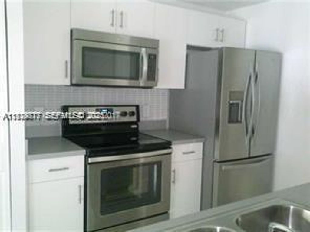 Photo of 2442 Centergate Dr #205, Miramar, FL 33025 (MLS # A11929717)