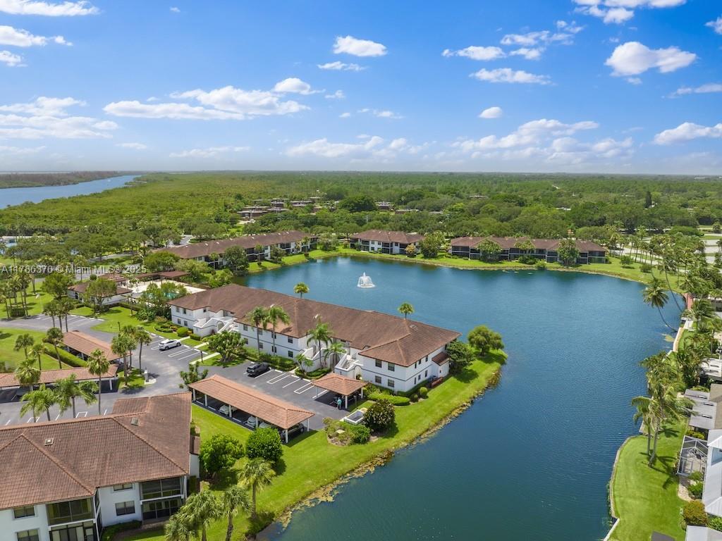 Time to sit back and relax in this beautiful water view 1st floor 3/2 corner condo with a storage room and in-unit washer and dryer. The community is situated on the intercoastal/St Lucie River with quick ocean access. Sip your morning coffee or unwind on your private, screened patio, with a stunning lake view as you watch the sunset over the water. The water view primary suite is a serene escape. Featuring a large closet and a luxurious en-suite bathroom with a glass shower and double vanity. The unit boasts tile flooring throughout and all-new appliances. This beautiful community offers a clubhouse, tennis, pickleball, basketball courts, a community pool, and pristine landscaping. Experience the ultimate in coastal living—where every day feels like a vacation. Welcome to your new home!