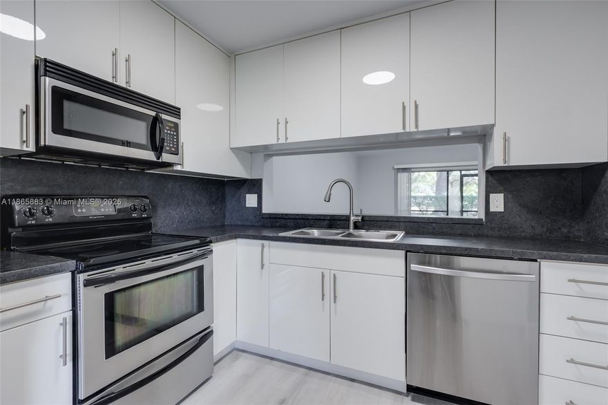 Updated 2 bedroom 2 bath first floor condo in Beacon Place, a quiet, well kept community in central Coral Springs behind Forest Hills West Park. Home has new flooring, new recessed lighting, new bathrooms with frameless roller sliding shower doors and stainless steel appliances in the kitchen. Freshly painted with a modern and neutral look. Full sized washer and dryer inside the unit. Large screened in patio. Parking spot right in front of your door, and plenty of guest spots as well. Large community pool. Just a 2 minute drive to The Walk at University. No commercial vehicles. Great landlord!