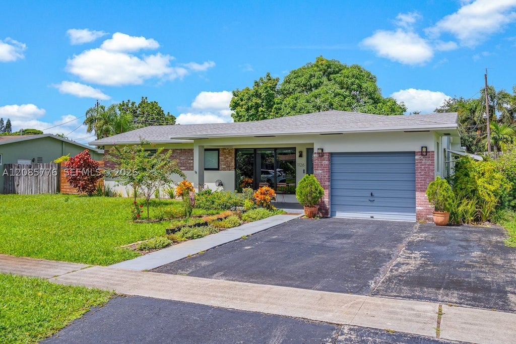 Photo of 1126 E Hawthorne Cir, Hollywood, FL 33021 (MLS # A12085776)