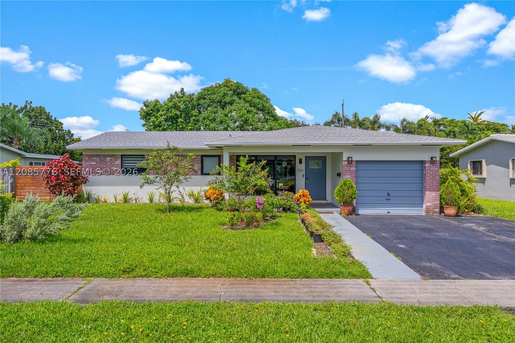 Photo of 1126 E Hawthorne Cir, Hollywood, FL 33021 (MLS # A12085776)