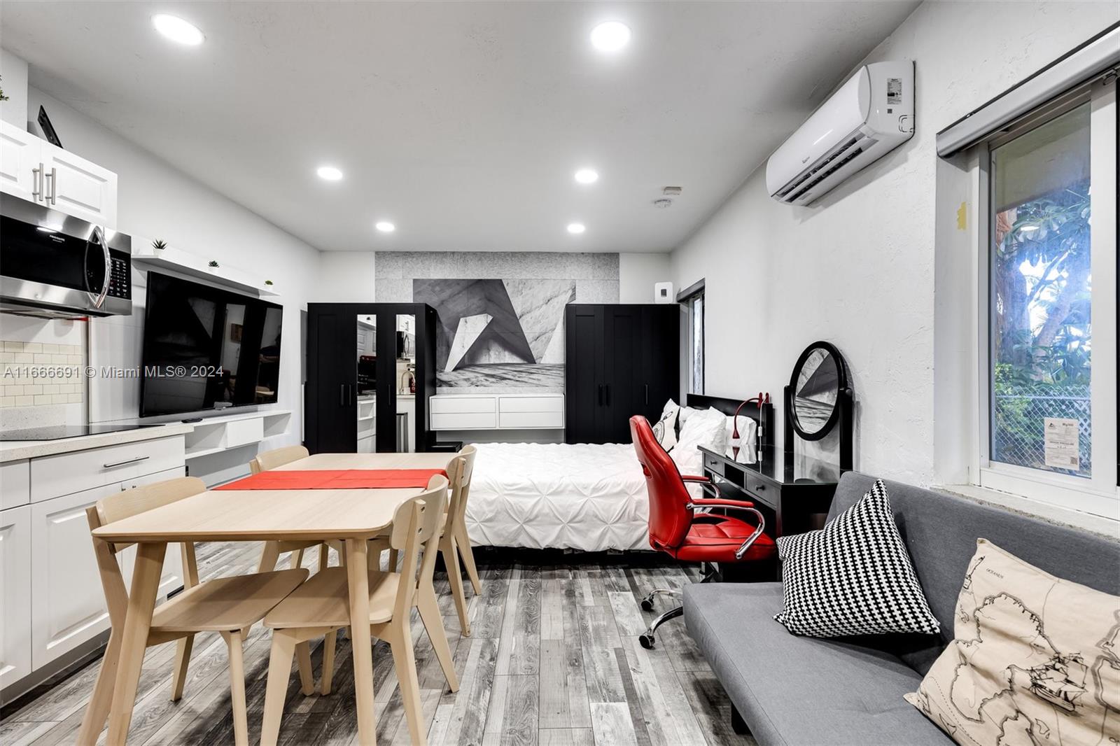 Fully remodeled, fully furnished very large studio apartment with full kitchen and washer/dryer. Property comes with WIFI, cable, water, sewer, trash and electric are included. bring your clothes everything else is here. you will not find a better apartment in the heart of north Miami Beach.