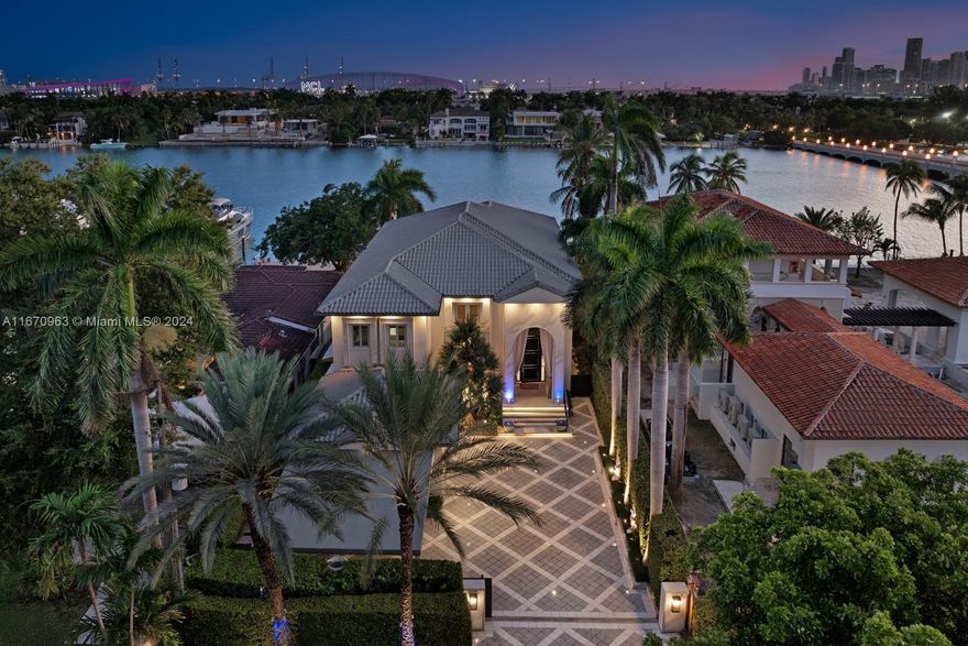 Welcome to luxury waterfront living at 176 S Hibiscus Drive in the heart of Miami Beach! This stunning 6-bed, 6.5-bath residence offers 60 feet of prime waterfront on one of the most prestigious islands in Miami Beach, with breathtaking views of downtown Miami. Equipped with two boat lifts—one holding 40,000 pounds & the other 20,000 pounds—a private dock,& summer kitchen, this home is a boater’s dream. A generator that powers the entire home. Inside, the high-end finishes & smart home technologies are evident. Mia Cucina kitchen is a chef’s delight, complemented by an elegant bar, & wine cellar. Unparalleled convenience, comfort,& security. Located on the prestigious Hibiscus Island, enjoy the best of Miami Beach living—close to world-class shopping, dining, & entertainment.