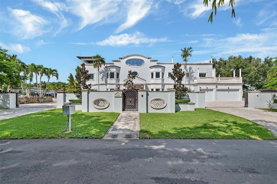 Luxury Live Auction! Bidding to start from $4,300,000.00! This absolutely breathtaking 9-bedroom, 8-full bath, 2-half bath villa is nestled on a sprawling acre lot, this estate redefines luxury living with its resort-style saltwater pool, spa, the covered patio, complete with a cabana surrounded by lush landscaping. The home dazzles with white ceramic tile floors, soaring ceilings, a dramatic grand staircase, and PGT impact windows and doors throughout. A state-of-the-art Savant smart home system ensures modern convenience, while an elevator and laundry chute add effortless functionality. The master suite features its own fireplace, two custom walk-in closets, and spa-like his-and-her bathrooms with a separate tub and shower. The home also offers a dedicated maid’s/in-law suite.