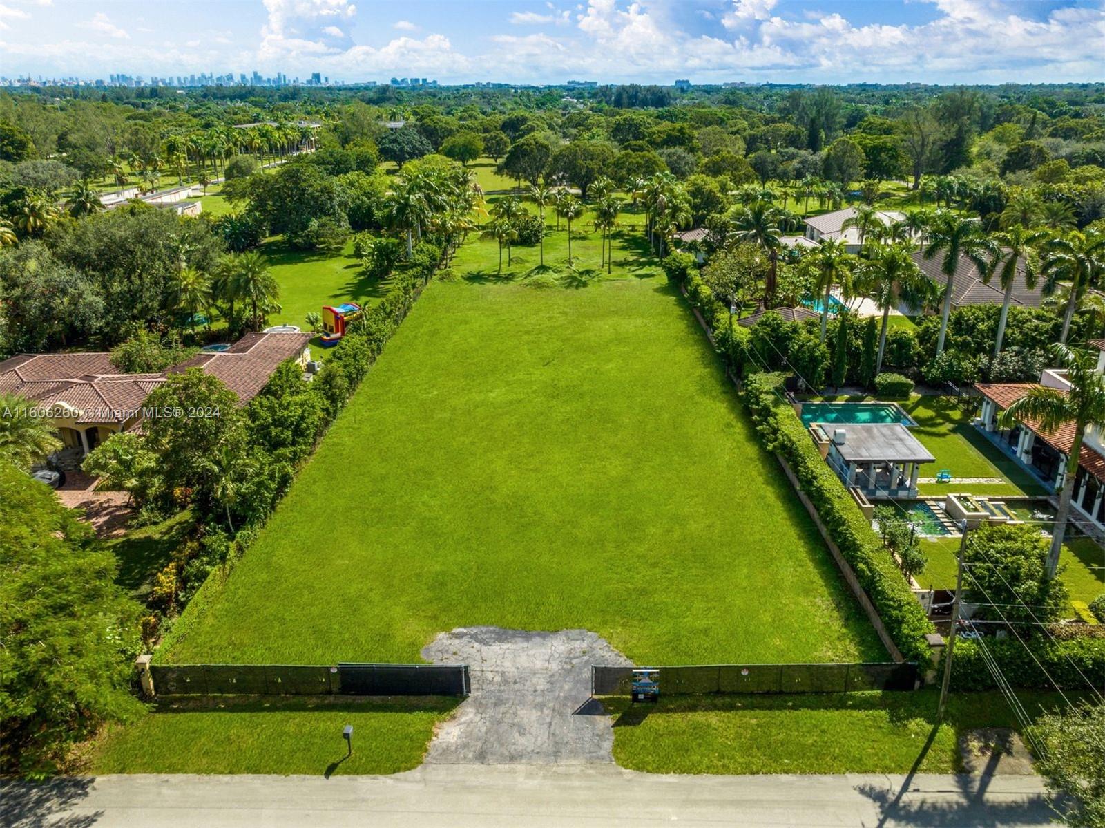 Build your dream home on this exceptional 50,000 sq.ft lot, a rare gem located on a peaceful, picturesque street in the vibrant heart of South Miami. Surrounded by stunning homes and welcoming neighbors, this spacious parcel offers the perfect canvas to design your forever home. With ample space to accommodate not only a luxurious residence but also personalized amenities like a tennis court or basketball court, the possibilities are endless. Don't miss this unique opportunity to create your own sanctuary of tranquility and luxury—act quickly to make this dream a reality!