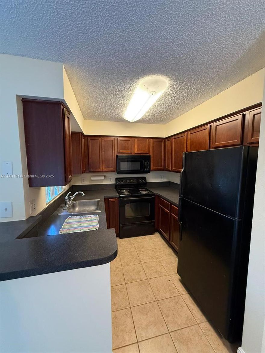 Beautiful 2-bedroom, 2-bathroom condo located in the desirable South Palm Place community. This spacious unit features tile floors throughout, an in-unit washer and dryer, and a stunning lake view from your private space. Perfectly situated near parks, shopping, and major highways, making commuting and daily living convenient. Easy to show – this one is a must-see!