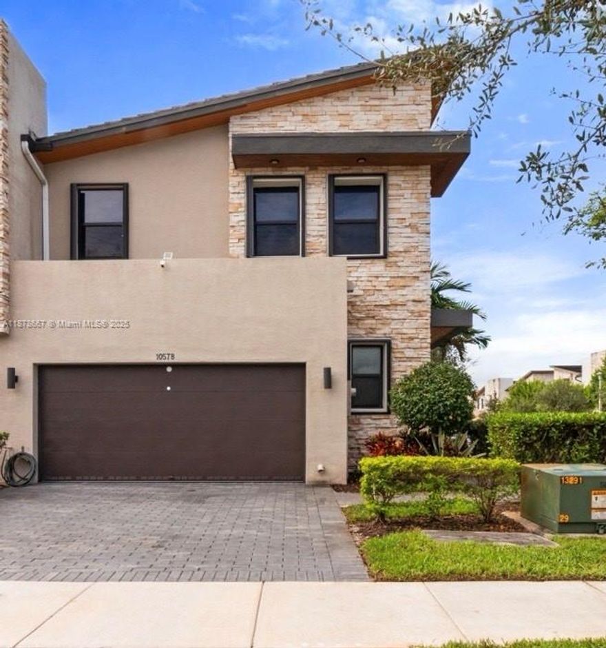 Extraordinary corner Townhouse, combines elegance, comfort and modern living, Enjoy the numerous upgrades like Hunter Douglas blinds, retractable patio roof, second refrigerator, kitchen with quartz countertops, stainless steel appliances, and custom cabinetry, as well as luxury bathrooms with designer finishes. Delight open concept living with high end flooring & contemporary lighting. Located in a sough after community offering amenities such as a beautiful Grand Central Club house, this move in ready home also provides easy access to shopping, dining and excellent schools. Making it the perfect blend of style and functionality!