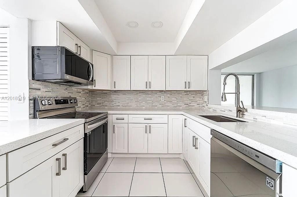Photo of 1931 Sabal Palm Dr #301, Davie, FL 33324 (MLS # A12018519)
