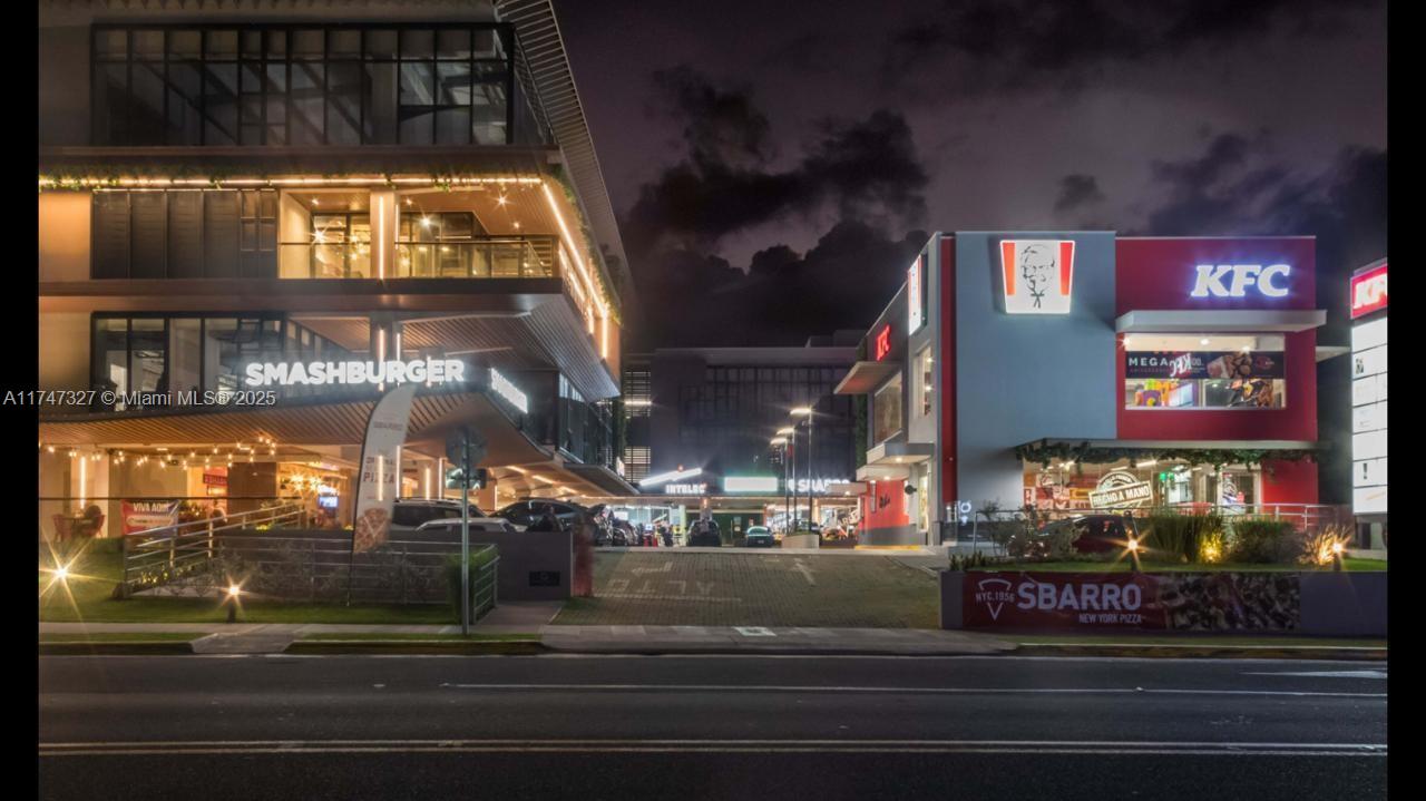 Plaza is centrally located in the most dynamic area of Costa Rica, surrounded by top-tier hospitals, shopping centers and office buildings.This prime corner property features a standalone drive-thru KFC with a long-term NNN lease. A leading tech company occupies the entire 2nd floor and part of the 3rd floor, alongside a diverse tenant mix that includes three restaurants, a renowned pharmaceutical lab, and a national electronics retailer. All tenants contribute to CAM and insurance cost. The plaza offers excellent accessibility with two elevators, two underground
parking garages and convient first-floor parking