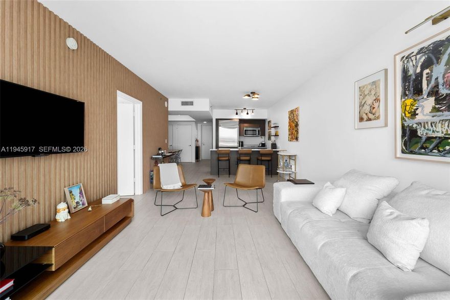 Tastefully curated residence in the heart of Brickell, featuring a modern open layout, designer lighting, and custom architectural details throughout. The sleek kitchen offers an oversized island with seating, stainless appliances, and seamless flow into expansive living and dining areas. A striking wood-accent feature wall anchors the living space, while floor-to-ceiling glass opens to a generous balcony ideal for indoor-outdoor living. Spacious primary suite with direct terrace access and spa-style bath with dual vanity, soaking tub, and glass-enclosed shower. Contemporary tile flooring, ample storage, and a cohesive neutral palette complete this fully finished turnkey residence offering comfort, style, and exceptional livability in one of Brickell’s most convenient full-service buildings. 

500 Brickell features resort-style amenities including two swimming pools, a state-of-the-art fitness center, sauna and steam rooms, resident lounge and entertainment spaces, theater, wine cellar, 24-hour concierge, security, and valet services. Ideally located just seconds from Brickell City Centre, Mary Brickell Village, world-class dining, shopping, nightlife, and public transportation, this residence delivers the best of urban Miami living.