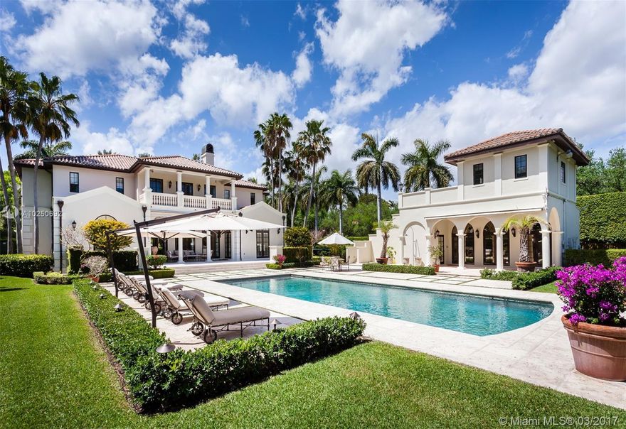 Tucked away behind a private gate, lies this enchanting estate on an impressive acre lot. Exuding elegance and serenity, the home features sprawling manicured gardens and a majestic fountain. With every room a mark of perfection, this home contains a formal dining room, living room, family room, game room, gourmet kitchen, guest house and full theater.The master suite has his-and-hers walk-in closets with custom built-ins and a private balcony overlooking the spectacular pool, gardens and basketball ct.