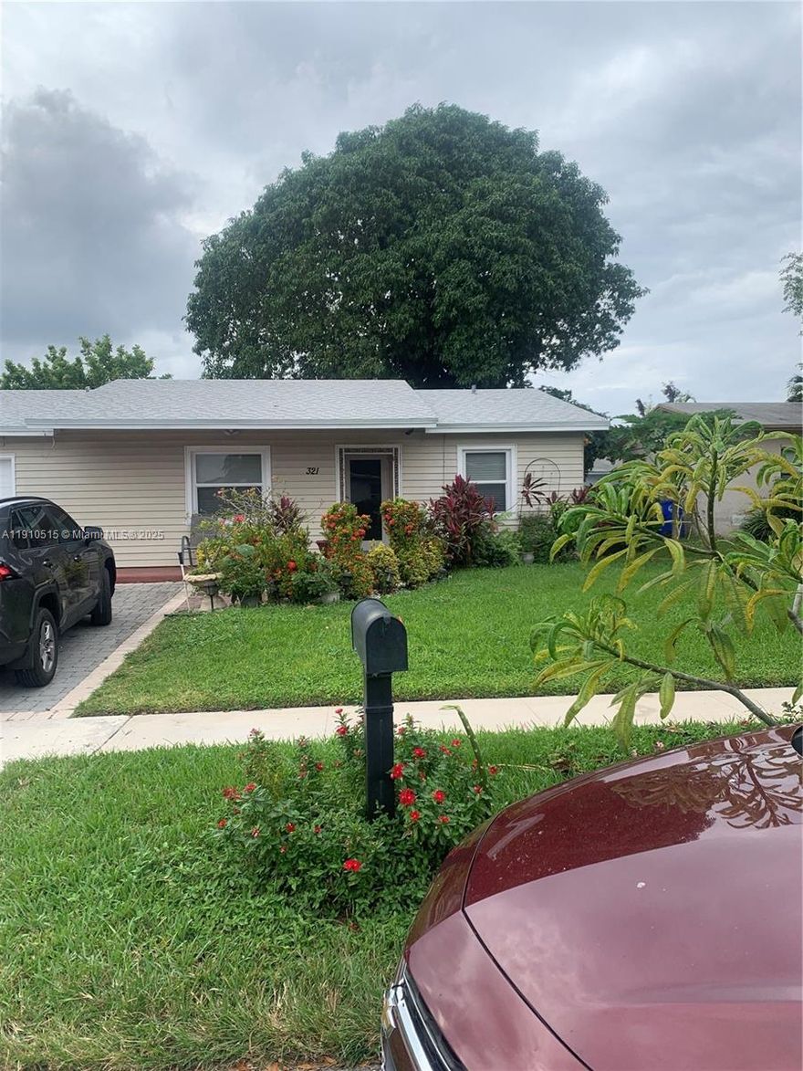 COME SEE THIS GORGEOUS, COMPLETELY UPGRADED MODEL LOOKING HOME IN THE HEART OF BEAUTIFUL N LAUDERDALE! THIS IS A 3/2 W/1 CAR GARGAGE. NOTHING HAS BEEN SPARED IN THIS HOME. CLASSY NEW LARGE WHITE TILES THROUGHOUT WHOLE LIVING AREA, WHITE TILED WALL, BRAND NEW GRANITE KITCHEN AND BEAUTIFUL CABINETS. WOOD LAMINATE IN BEDROOMS. VERY SPACIOUS OPEN FLOOR PLAN THAT MAKES THE HOME FEEL SO FRESH AND FLORIDA LIKE! NEW A/C , NEW ROOF, GORGEOUS FAUX GREEN GRASS MAKES THE BACK YARD WONDERFUL. ALL HURRICANE IMPACT WINDOWS (BESIDES THE KITCHEN WINDOW) AND HURRICANE IMPACT DOORS WITH FRENCH DOORS LEADING TO THE BACK YARD. FRONT IS LUCIOUS FLOWERS AND VERY QUIET AND QUAINT NEIGHBORHOOD. READY TO MAKE THIS YOUR BUYERS NEW HOME! THEY WILL LOVE IT. MAKE THIS YOUR CLOSING PROPERTY.