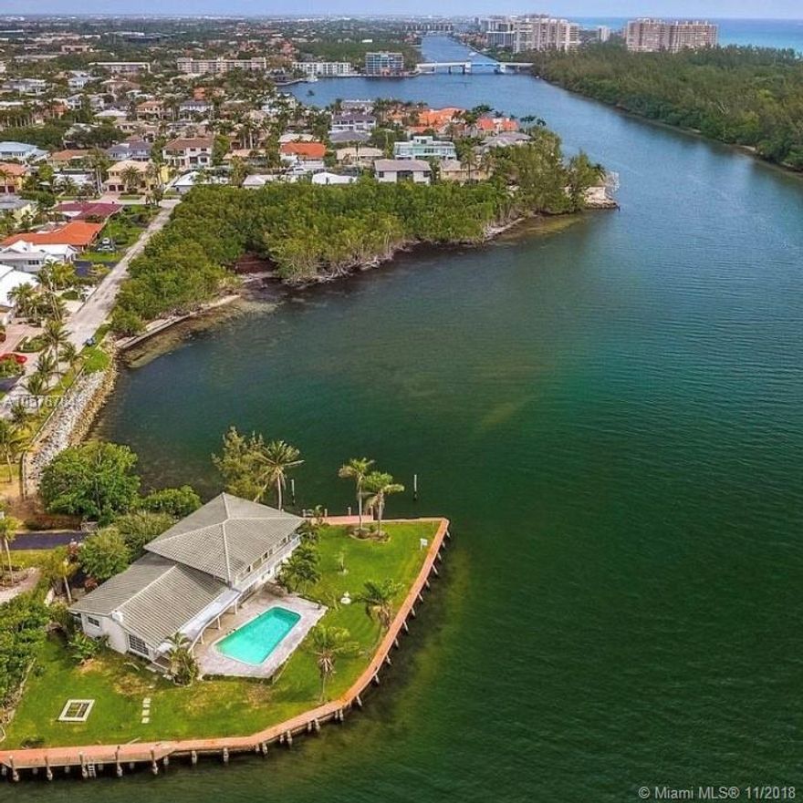 One of a kind point lot surrounded by water on 3 sides in best location of Boca Raton. Feautring 350 feet of deep water dockage overlooking the beautiful intracoastal. Renovate or once in a lifetime opportunity to build your dream home (around 10,000 sq feet) with panoramic water views from every window! Also available for rent at $9500 a month. Bring your yachts - electric on dock! Short walk to the beach! Great school district!