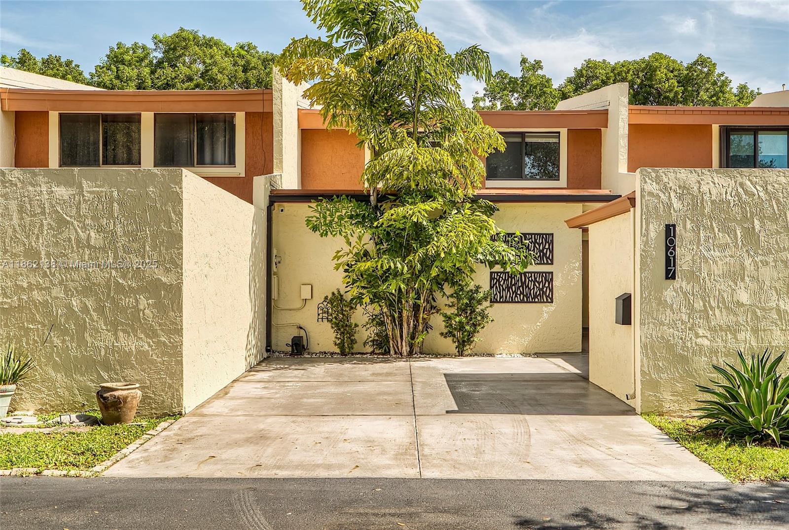Beautifully and completely updated 3/2.5 townhouse with an additional room that can serve as a 4th bedroom—bringing the total living area to 1,839 sq. ft. Room offers a custom built-in desk, ideal for a home office or flex space. The interiors shine with bamboo floors throughout, impact windows and doors, custom closets, an updated kitchen with granite countertops and top-of-the-line appliances, and elegant bathrooms with marble finishes and Hansgrohe fixtures. Additional highlights include a newer roof (2016), A/C (2017), fresh paint, and extra storage space outside. Truly turnkey! Located in a highly desirable community offering fantastic amenities including a pool, tennis courts and gym.