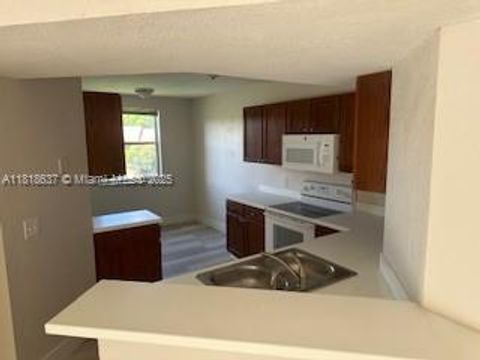 Photo of 8741 Wiles Rd #208, Coral Springs, FL 33067 (MLS # A11818637)