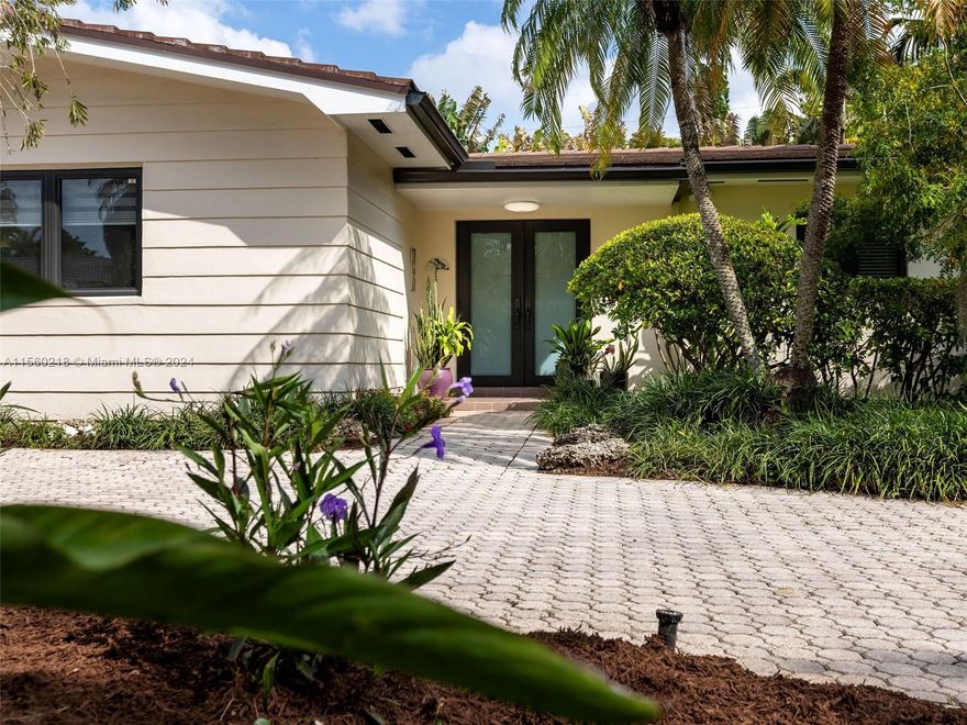 Welcome to this stunning residence in Coral Gables, on a gorgeous tree-lined street offering luxury living in one of the city's most sought-after neighborhoods. On a sprawling 11,500 SF corner lot with a circular driveway, 2 car garage, impressive layout, 3 BR’s, 3 full Bths. Generously proportioned living rm, formal dining rm, & kitchen featuring white quartz countertops and stainless-steel appliances. Impact windows and doors, newer roof and electrical panel, 2 A/C units 2021 & 2018. Screened-in very private pool surrounded by lush mature landscaping. Strategically located in one of Coral Gables' most coveted and prestigious areas, providing easy access to Coconut Grove, South Miami, and Old Cutler Road. Don't miss the opportunity to make this one-of-a-kind Coral Gables gem your home.