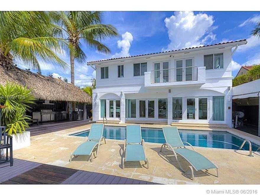 Tranquil renovated waterfront home on the prestigious and highly sought after Venetian Islands with westerly sunset views. With four bed and four bath this modern home has open floor plan with indoor/outdoor entertaining. Gourmet kitchen, custom cabinetry, floating staircase and impact windows throughout. Private 2nd floor master suite with stunning downtown Miami skyline views. 20,000 LBS boat lift, jet ski dock, swim dock, hot tub, Tiki Hut, and summer kitchen.