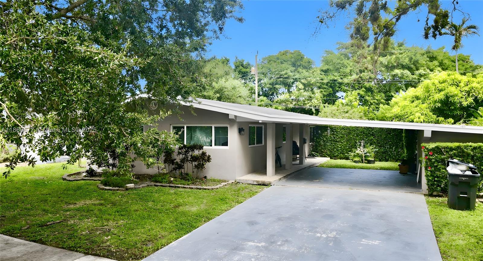 Discover this stunning 3-bedroom + den, 2-bathroom home in the heart of Hollywood with no HOA fees. Enjoy a private, fenced backyard perfect for relaxing or entertaining, plus a bright, open layout. The updated kitchen boasts stainless steel appliances and sleek porcelain floors. The spacious primary suite features stylish vanities and a custom walk-in shower. Additional perks include a 2-car carport, a smart floor plan, and recent upgrades for added convenience. Ideal as a primary home or Airbnb investment, it’s blocks from Hollywood Boulevard’s shops and dining and minutes from I-95. Updates include a new roof, a 5-year-old HVAC system, and Cat 5 impact windows and doors. Showings require 24 hours' notice, and the seller is offering a 1% closing cost contribution!
